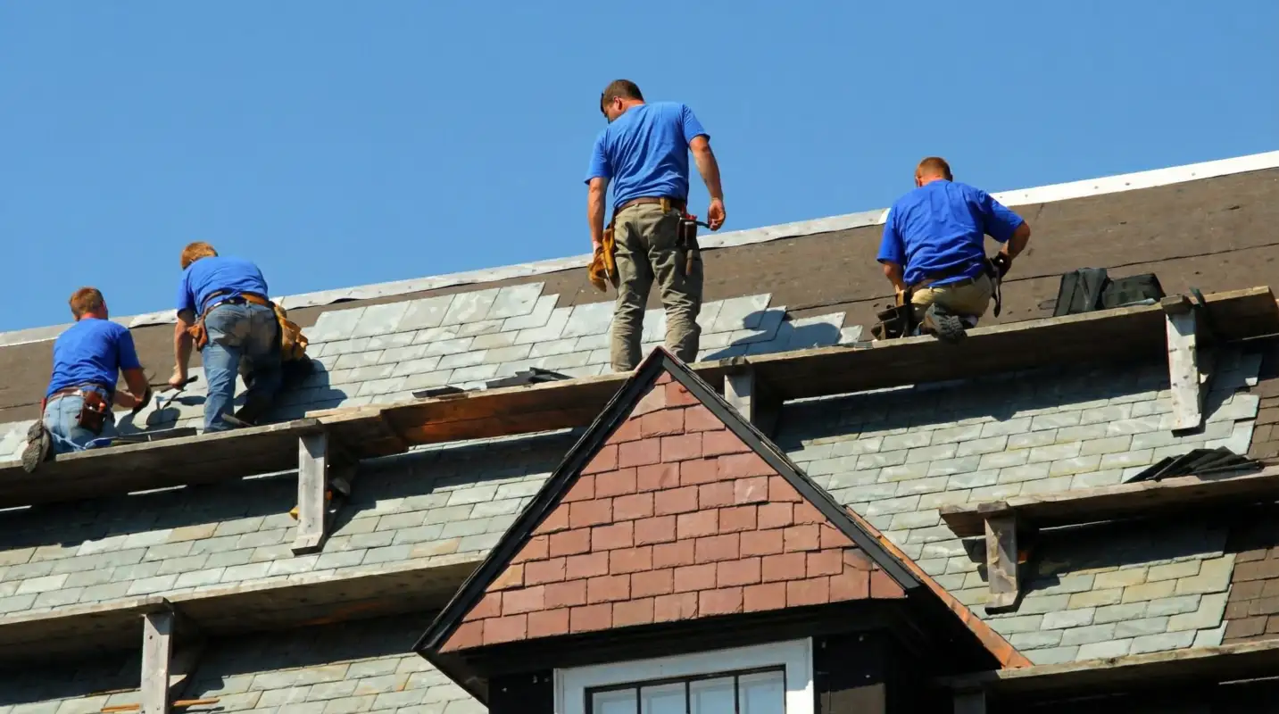 Roof replacement in progress with a team of professional contractors installing new shingles on a residential home in Fort Worth, TX