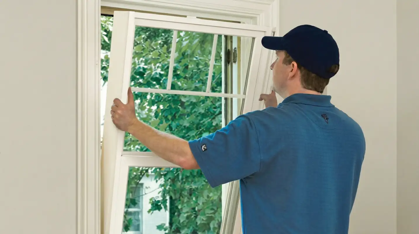 Professional contractors performing a residential window insulation and replacement service in Fort Worth, TX